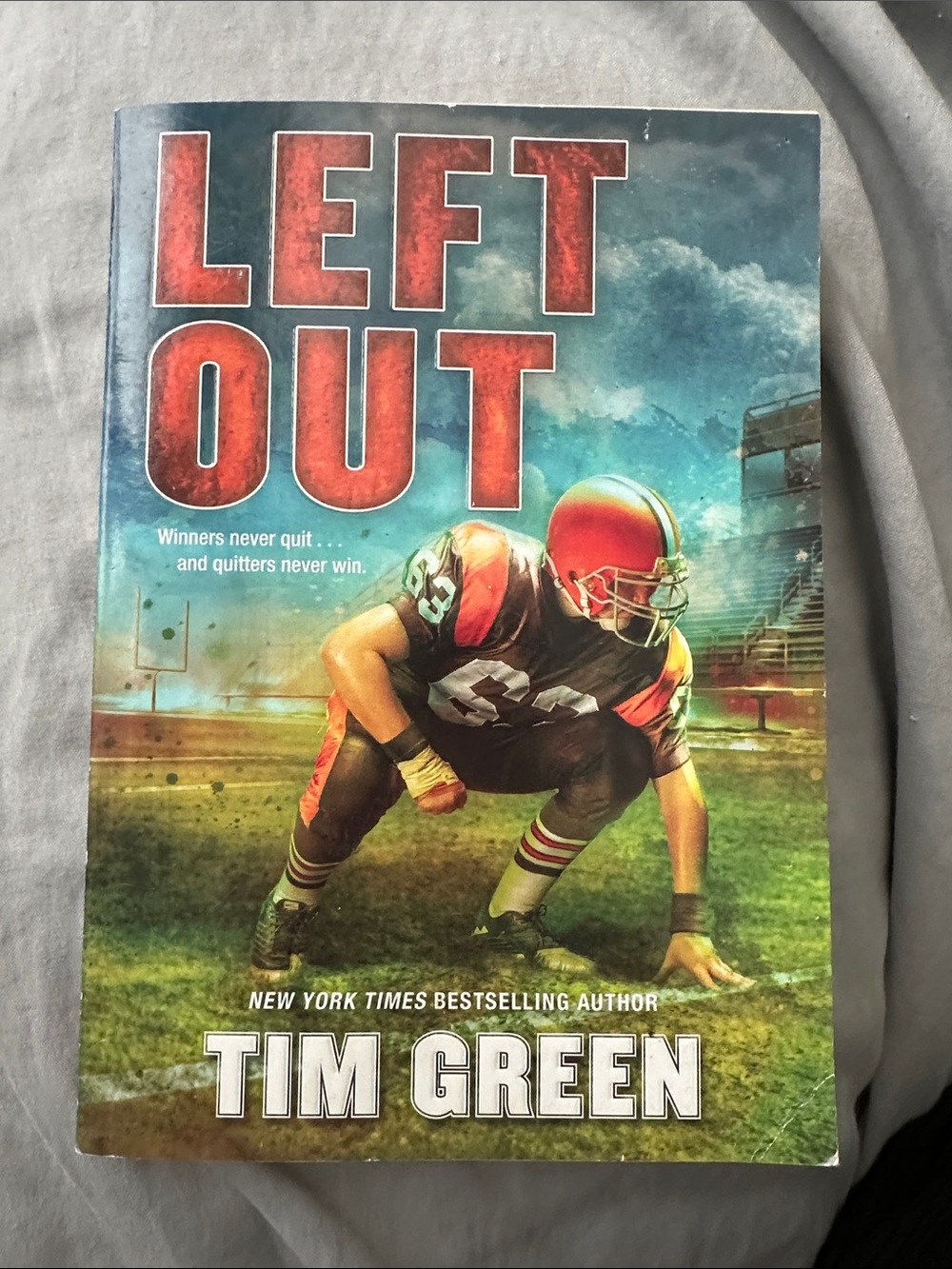 Left Out Paperback - Red/Black Football Cover